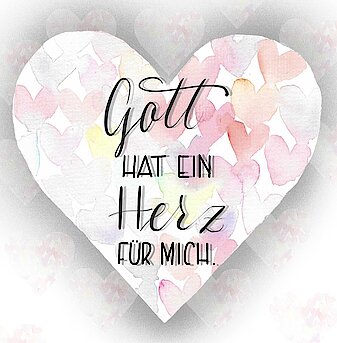 Ein herzförmiger Ausschnitt mit der Aufschrift: "Gott hat ein Herz für mich"